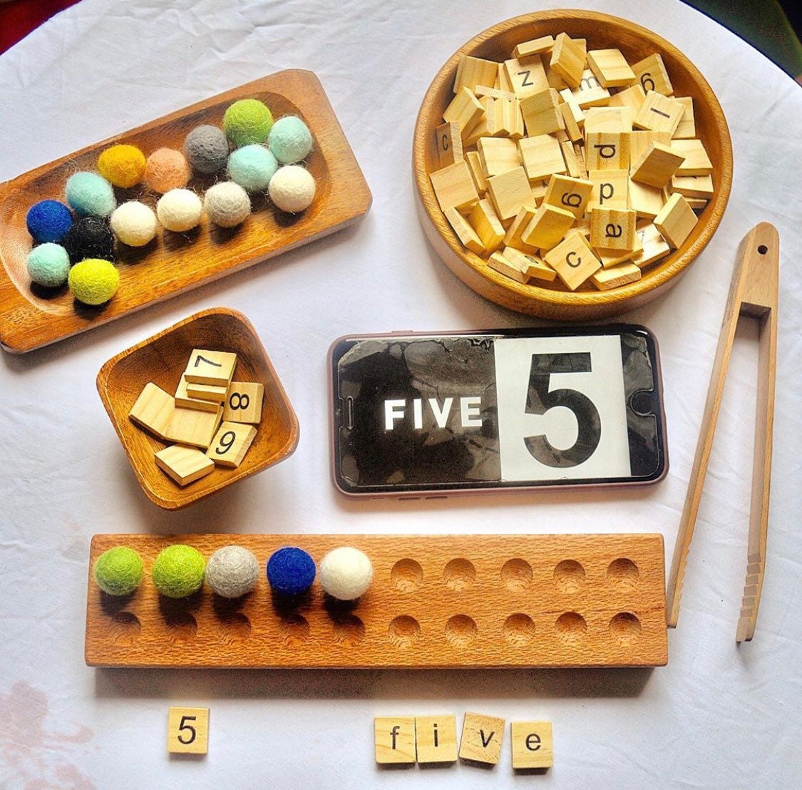 1-10 Wooden Number Tiles: Wooden tiles for number recognition and counting practice.