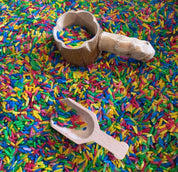 Water play scoop with holes in a bucket, perfect for sensory or outdoor play.