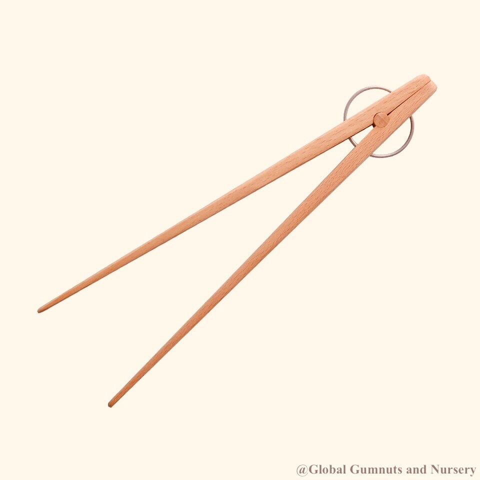 Wooden springy tongs, chopstick-like fun for kids or kitchen use.