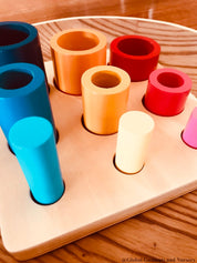 Cylinder block puzzle, an educational Montessori tool for developing spatial awareness and fine motor skills.