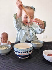 Wooden springy tongs, chopstick-like fun for kids or kitchen use.