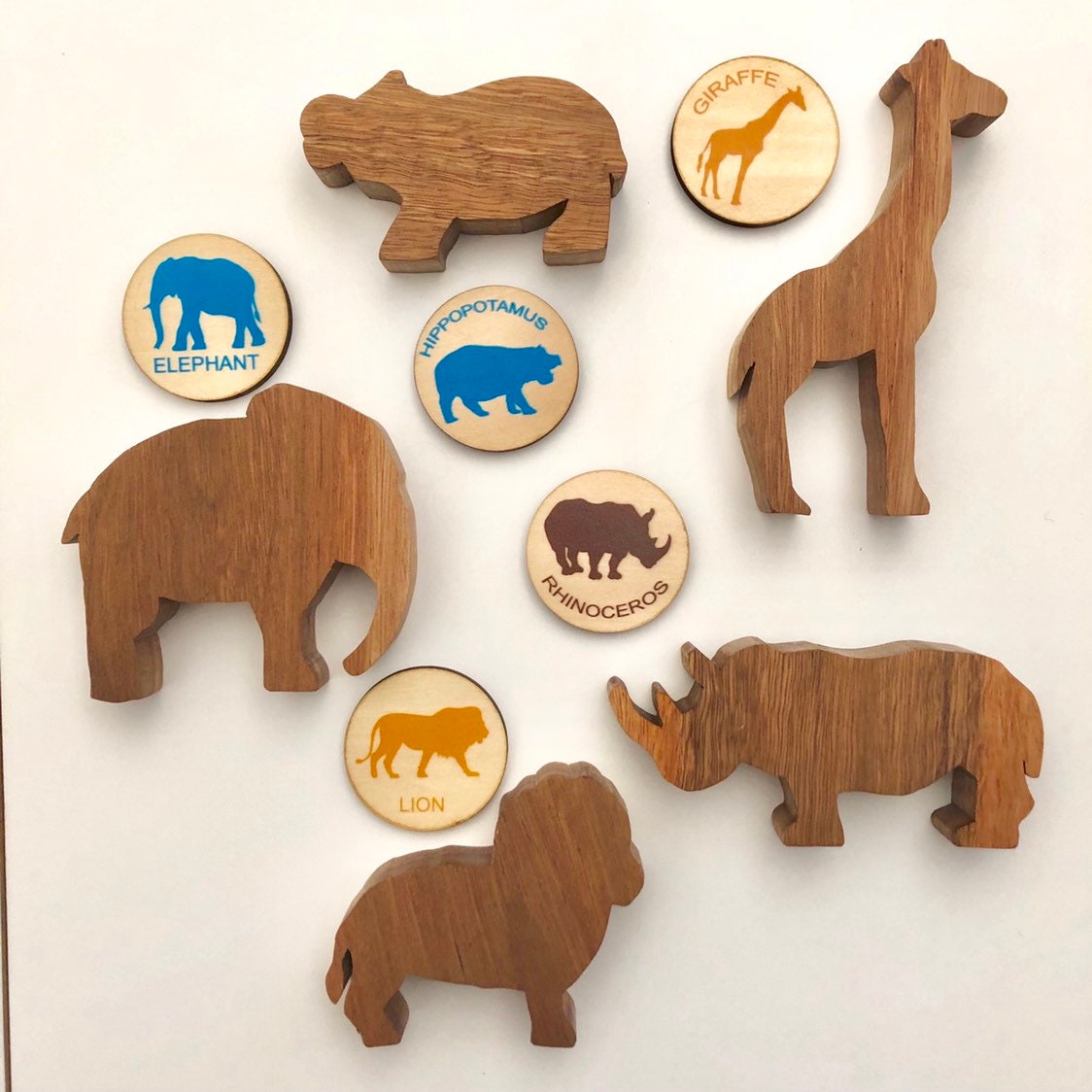 Matching animal game with wooden discs, a Montessori-inspired matching toy.
