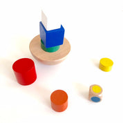 Colorful 8-piece wooden geometric block balancing game. Perfect for improving motor skills and encouraging STEM learning through play.