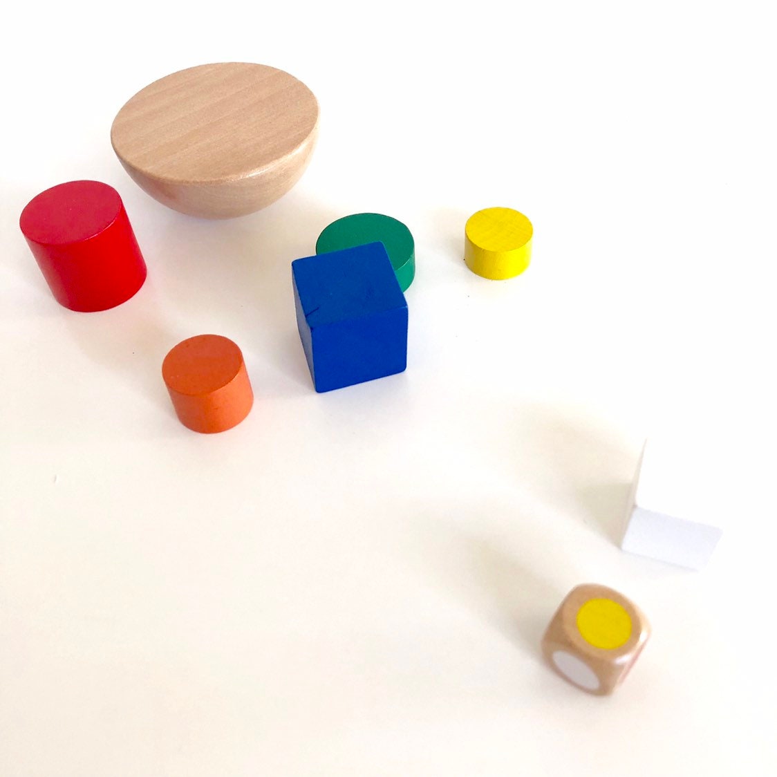 Colorful 8-piece wooden geometric block balancing game. Perfect for improving motor skills and encouraging STEM learning through play.