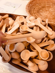 Teaspoon Scoops – Mini Natural Child: Small wooden scoops for sensory play and exploration.