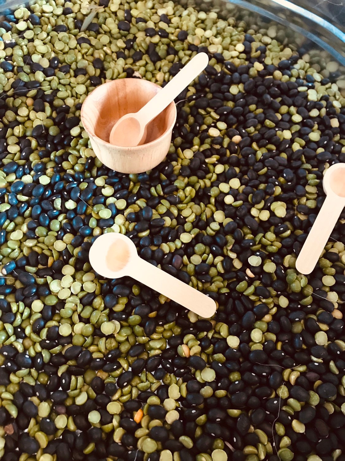Teaspoon Scoops – Mini Natural Child: Small wooden scoops for sensory play and exploration.