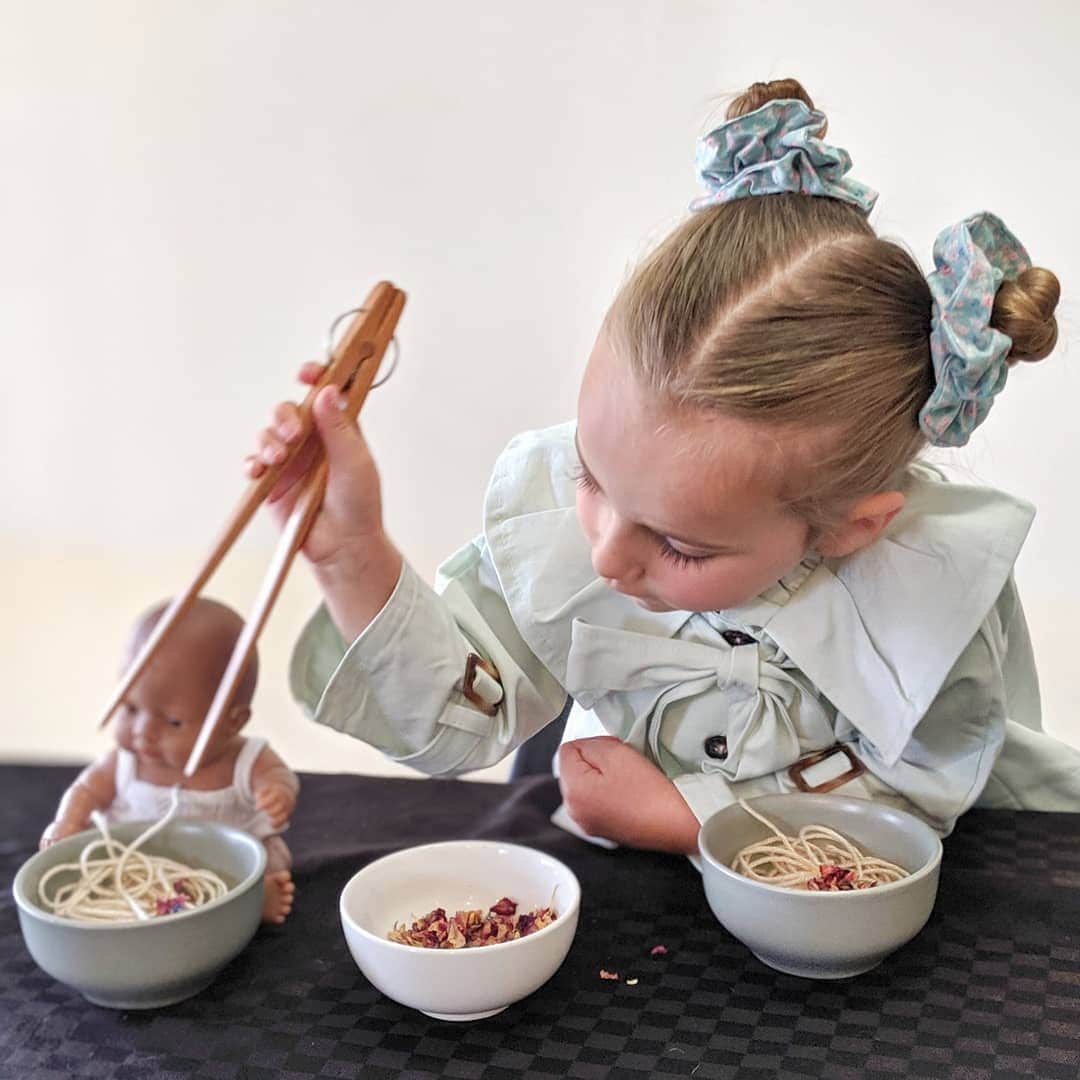 Wooden springy tongs, chopstick-like fun for kids or kitchen use.