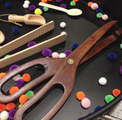 Wooden Scissor Tongs: Play tongs for motor skill development and pretend kitchen play.