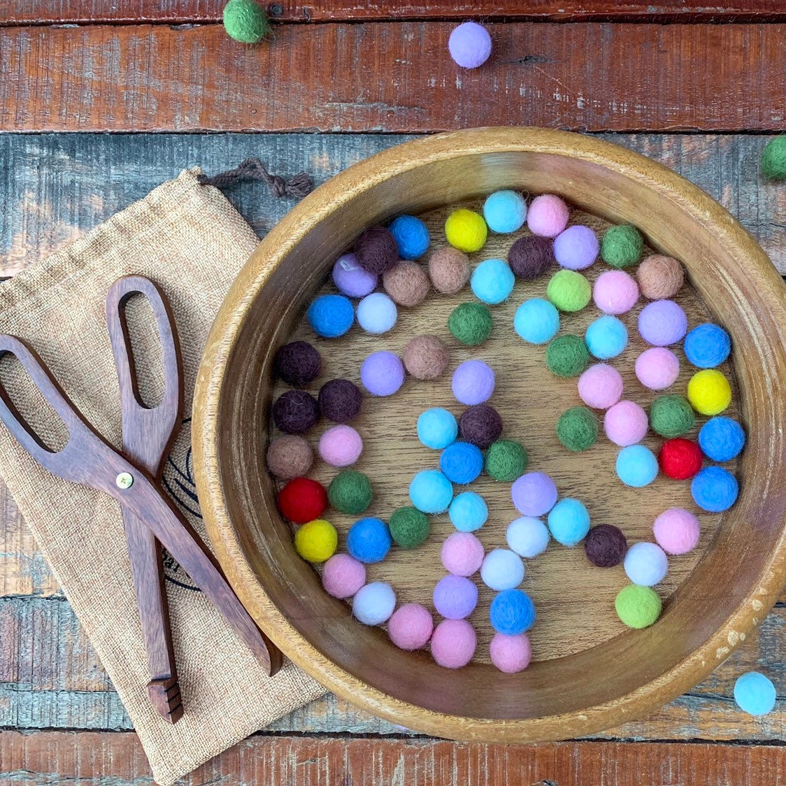 Wooden Scissor Tongs: Play tongs for motor skill development and pretend kitchen play.