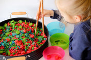 Wooden springy tongs, chopstick-like fun for kids or kitchen use.