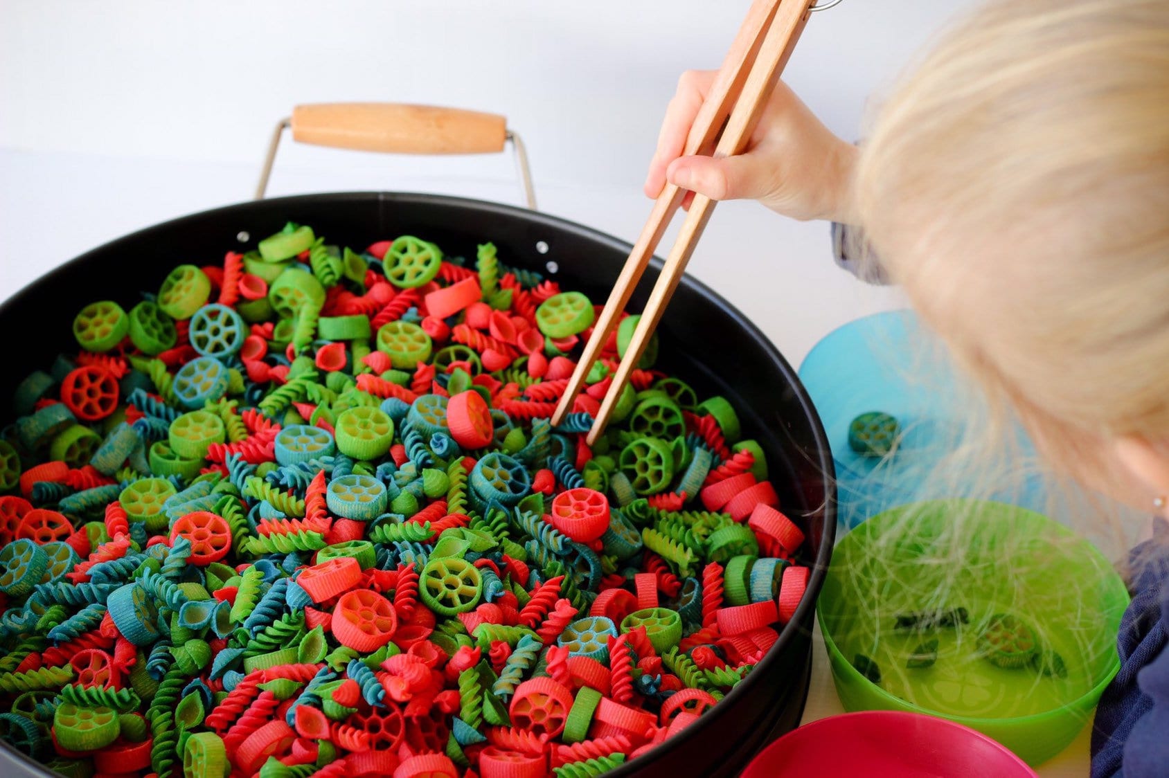 Wooden springy tongs, chopstick-like fun for kids or kitchen use.
