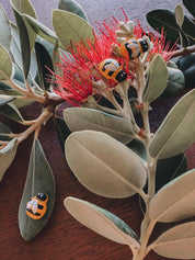 Mini Wooden Bees: Small wooden bee figurines for creative play.