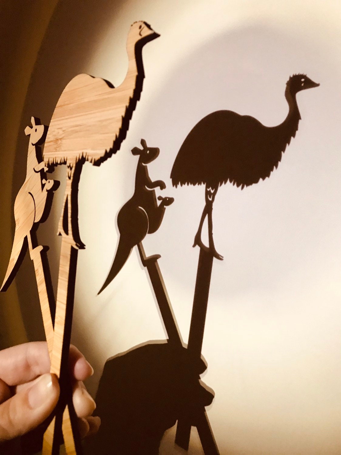 Individual wooden Australian animal puppets featuring emu, koala, crocodile, and more for play or storytelling.