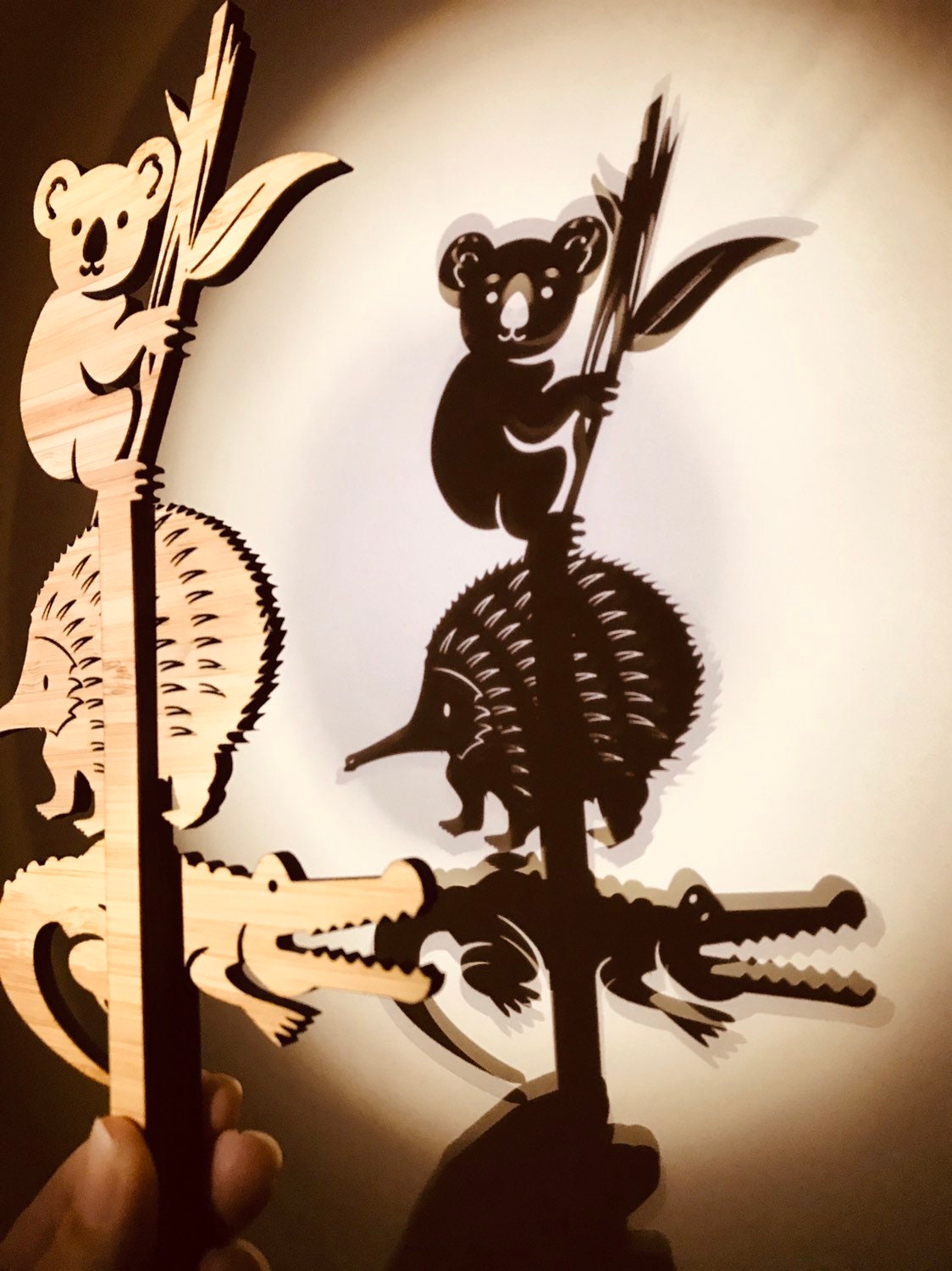 Individual wooden Australian animal puppets featuring emu, koala, crocodile, and more for play or storytelling.