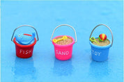 Miniature beach buckets for small-world play. Perfect for imaginative beach or summer-themed setups.