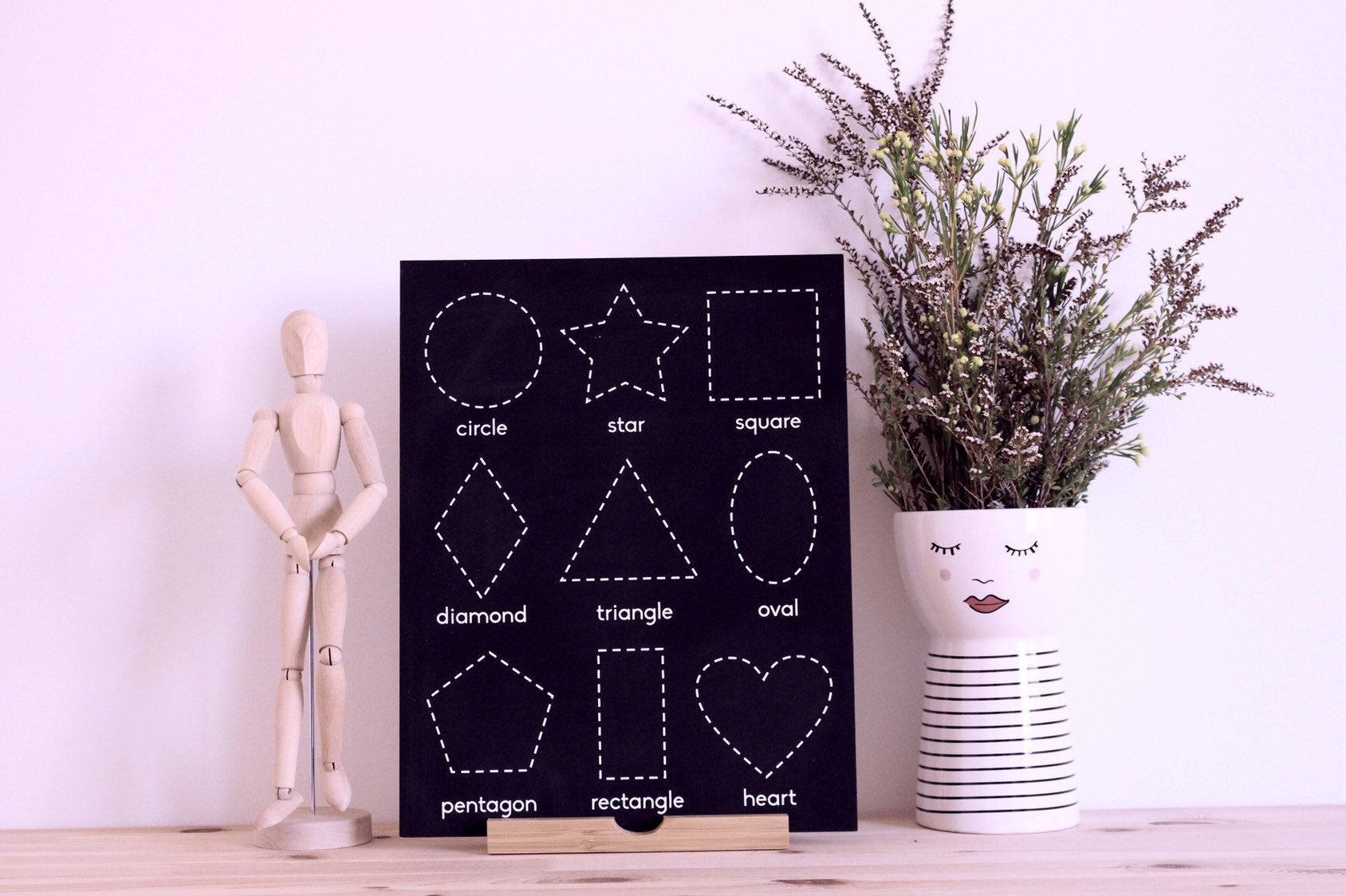 Shapes chalkboard featuring 9 common shapes, perfect for early learning.