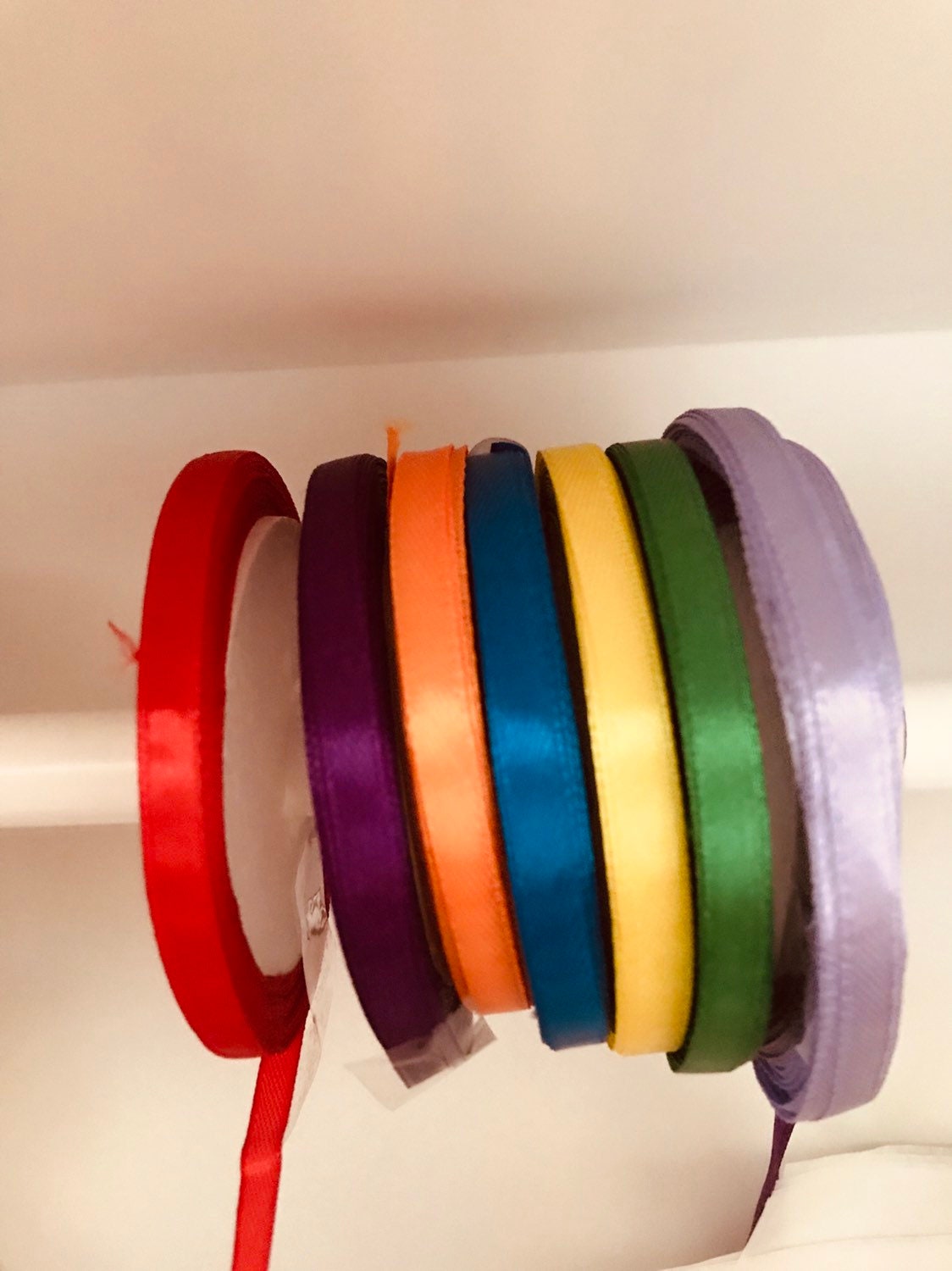 kids wooden view finder: nature exploration tool for observing clouds and leaves.