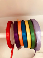 kids wooden view finder: nature exploration tool for observing clouds and leaves.