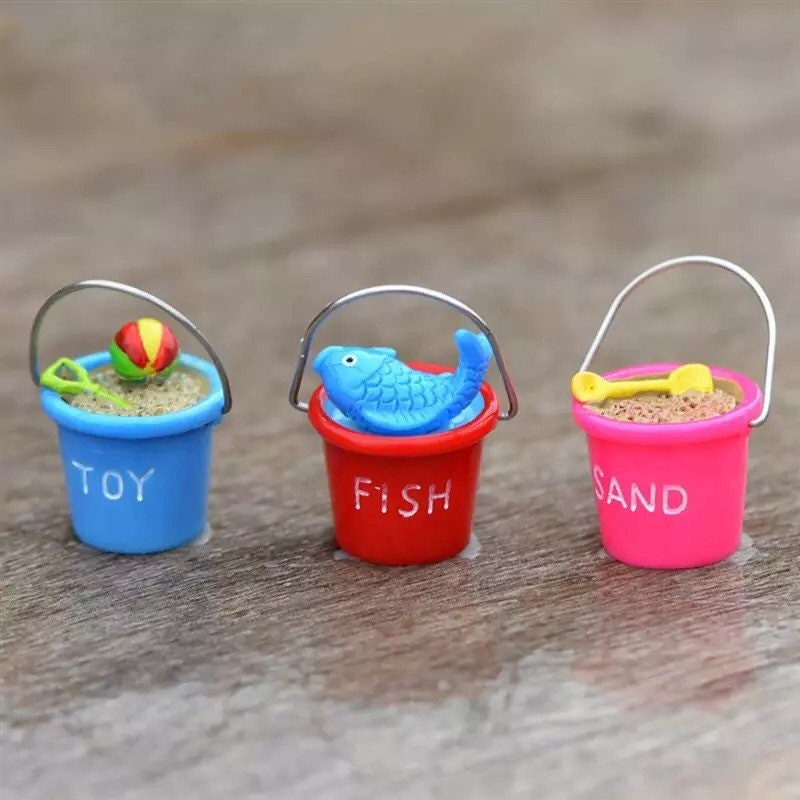 Miniature beach buckets for small-world play. Perfect for imaginative beach or summer-themed setups.