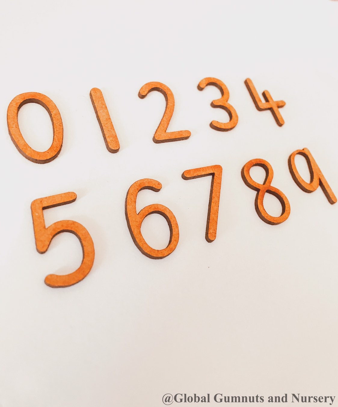 0-9 Wooden Number Set: Ten-piece set of wooden numbers for learning and play.