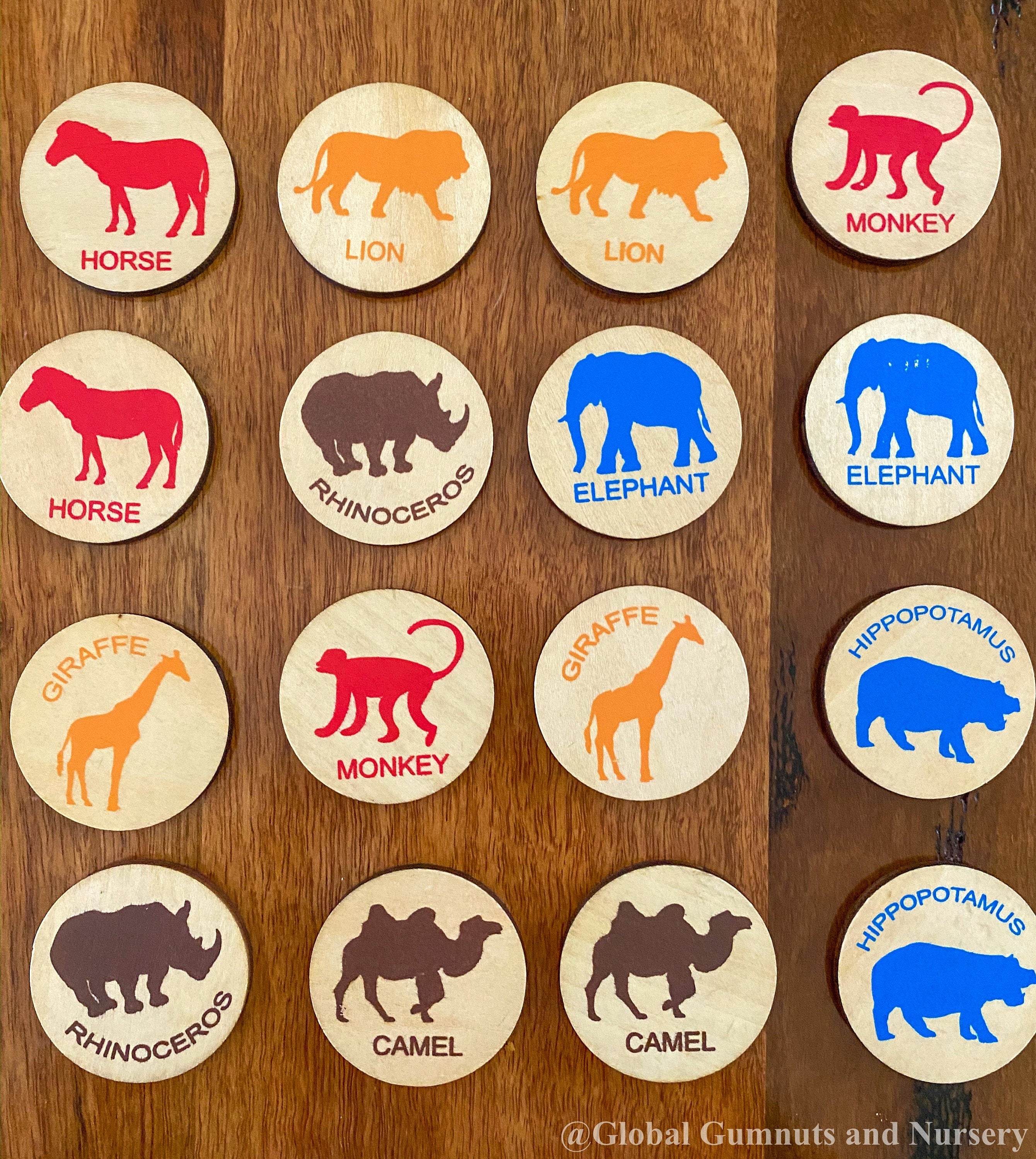 Matching animal game with wooden discs, a Montessori-inspired matching toy.
