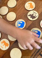 Matching animal game with wooden discs, a Montessori-inspired matching toy.
