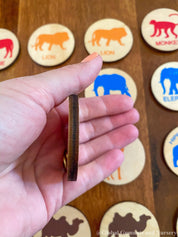 Matching animal game with wooden discs, a Montessori-inspired matching toy.
