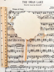 Natural wooden rattle drum, an engaging and eco-friendly musical toy for babies.
