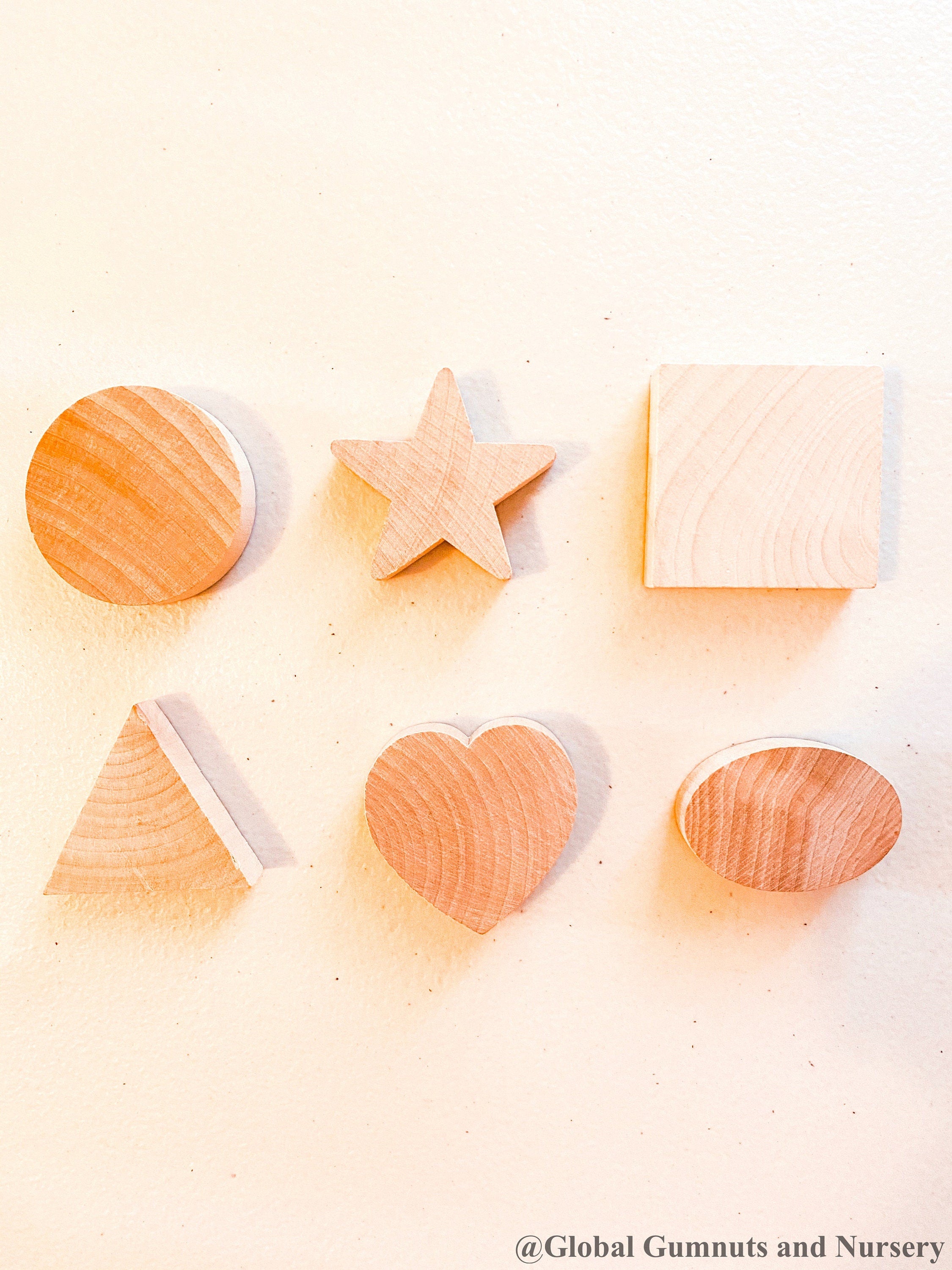 Chunky wooden shape set with 6 playful designs, ideal for teaching shapes, sensory play, and early learning activities.