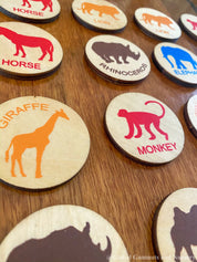 Matching animal game with wooden discs, a Montessori-inspired matching toy.
