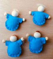 Tiny felt worry dolls, comforting companions designed to help children with big worries.
