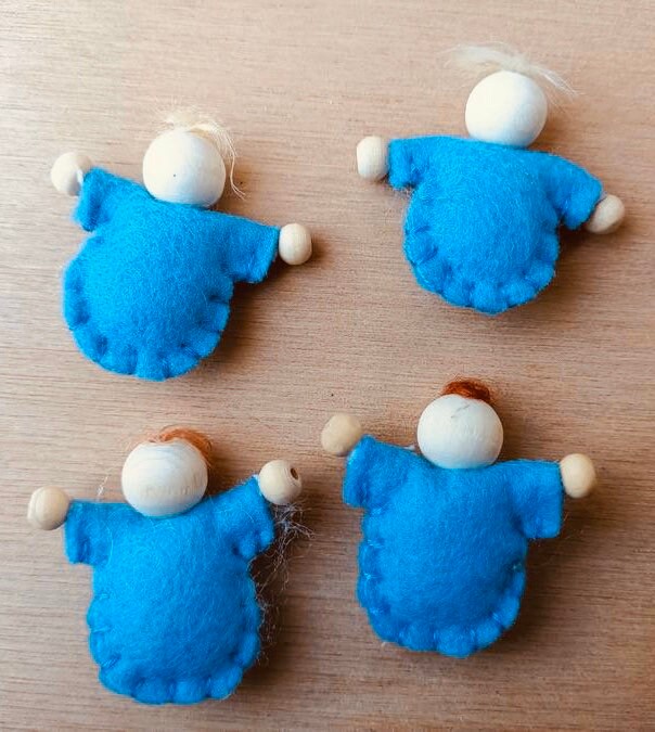 Tiny felt worry dolls, comforting companions designed to help children with big worries.
