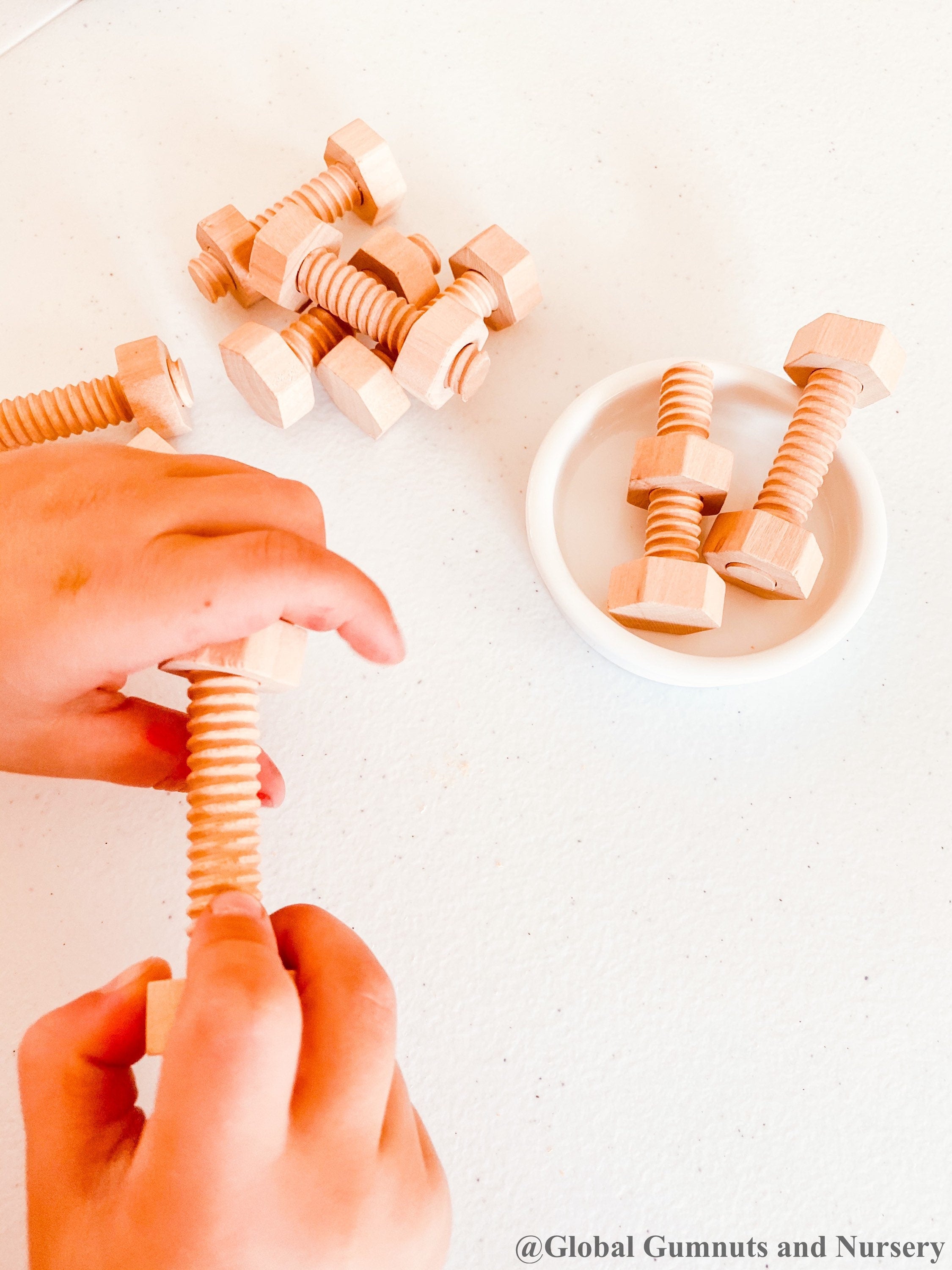 Wooden Nuts & Bolts Set: Six-piece set for motor skill development through play.