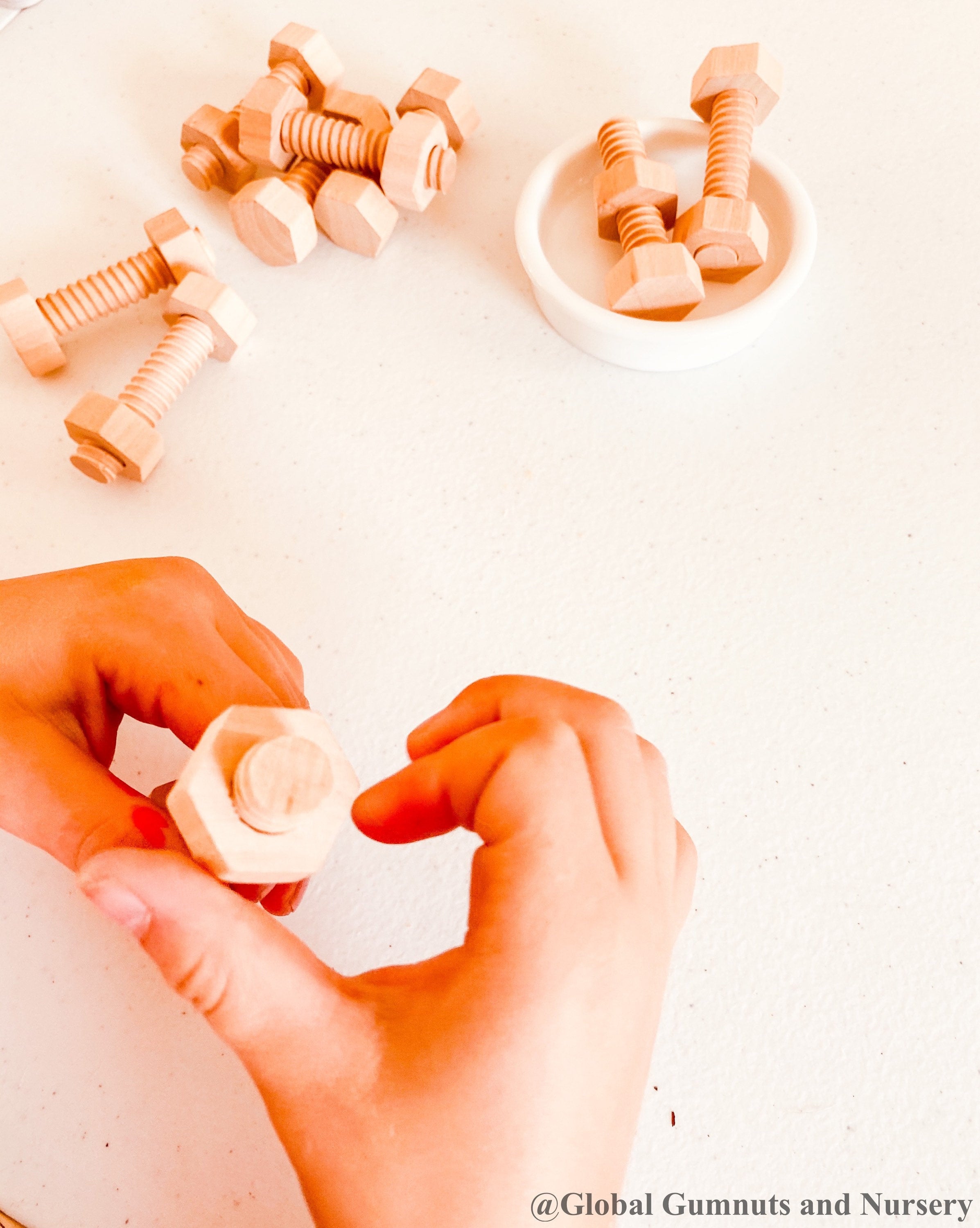 Wooden Nuts & Bolts Set: Six-piece set for motor skill development through play.