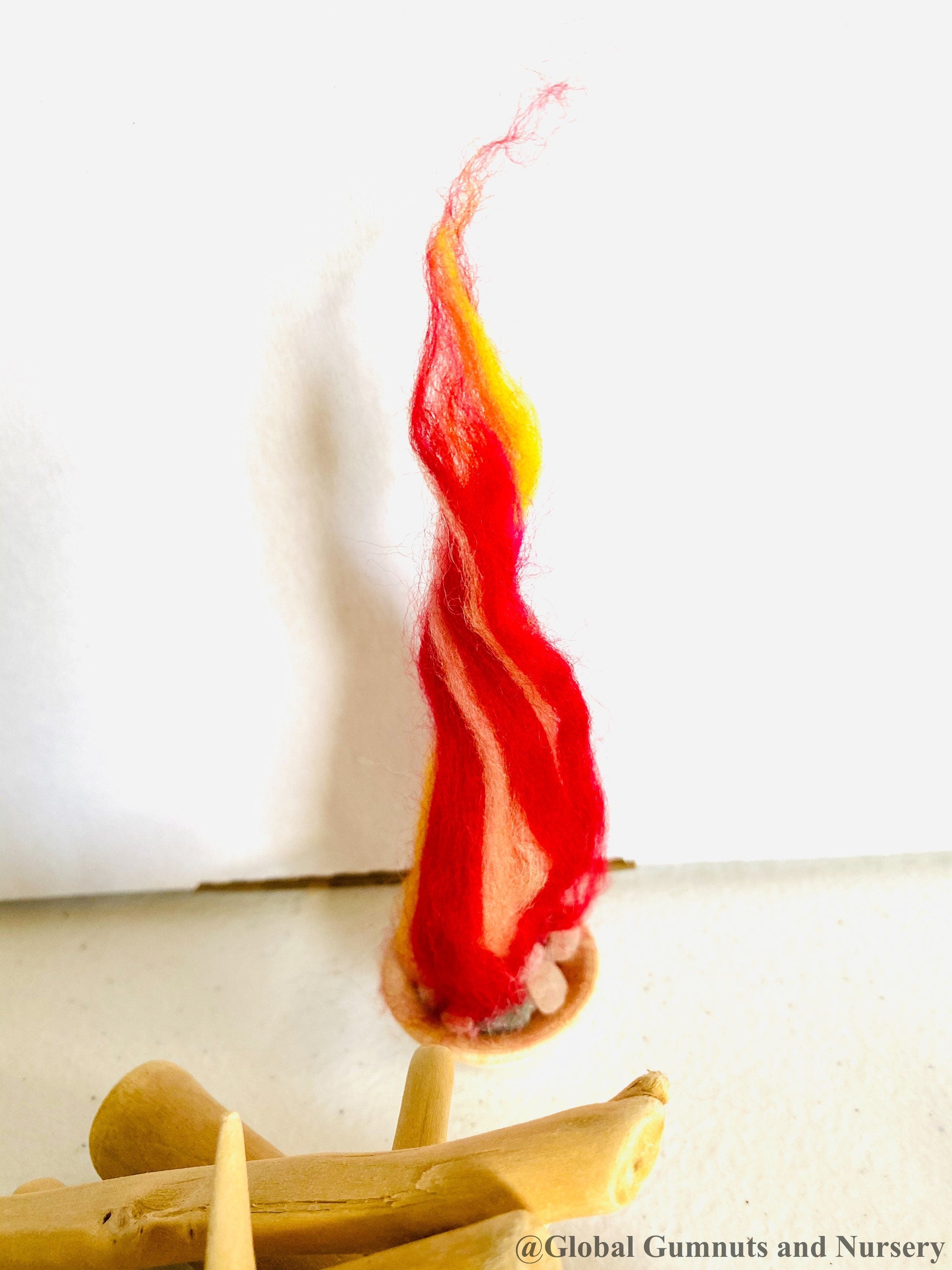 Felt Fireplace Set: Felt fireplace with decorative firewood and stones.