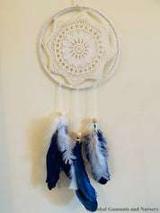 Navy blue baby boy dream catcher mobile, featuring feathers and a blue-and-white design for a soothing nursery.
