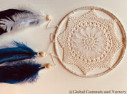 Navy blue baby boy dream catcher mobile, featuring feathers and a blue-and-white design for a soothing nursery.