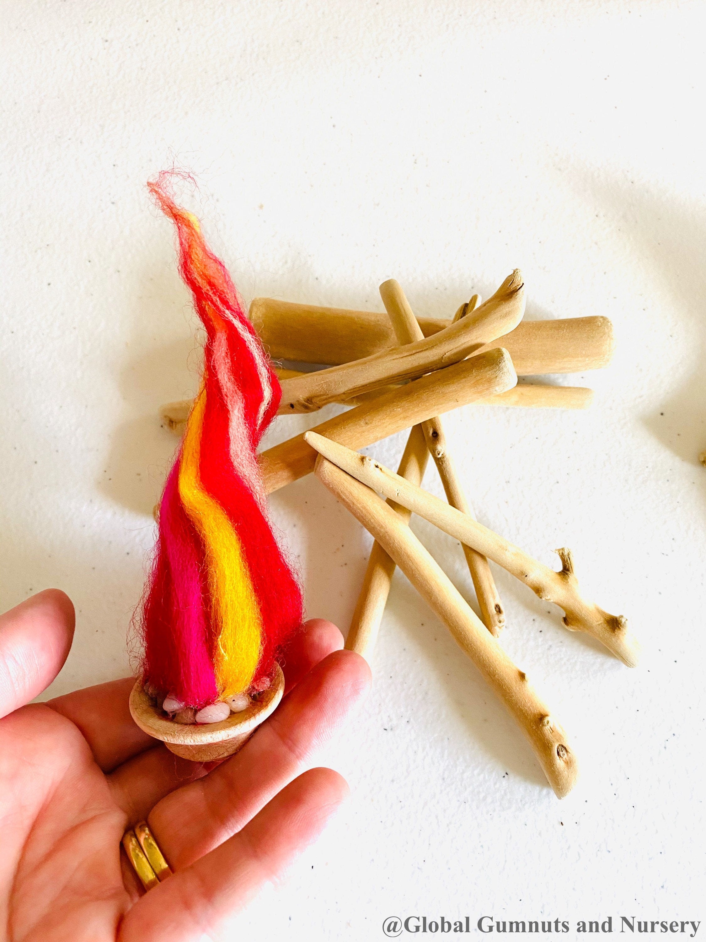Felt Fireplace Set: Felt fireplace with decorative firewood and stones.