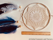 Navy blue baby boy dream catcher mobile, featuring feathers and a blue-and-white design for a soothing nursery.