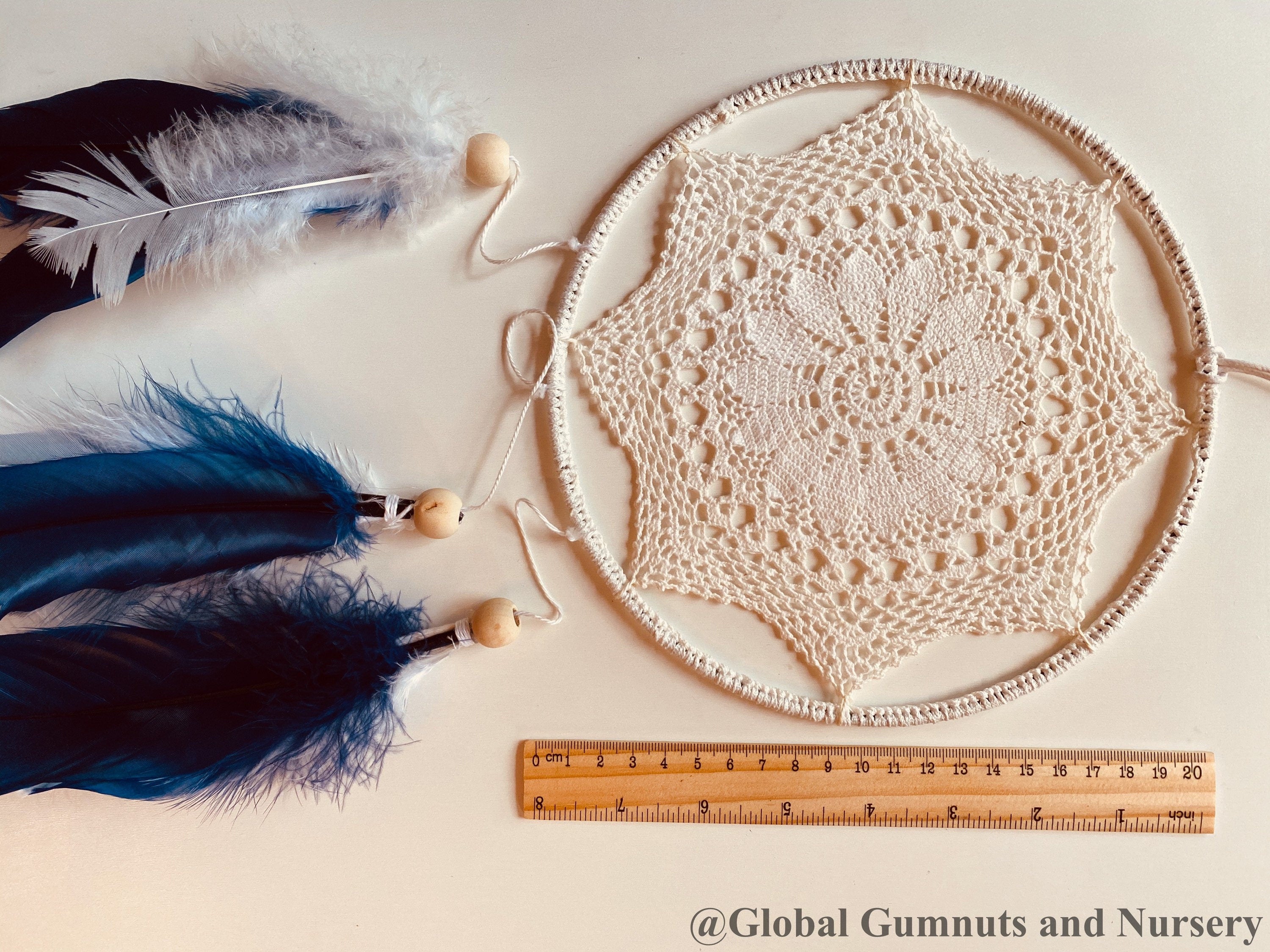 Navy blue baby boy dream catcher mobile, featuring feathers and a blue-and-white design for a soothing nursery.