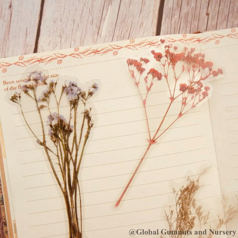 Floral scrapbooking set featuring intricate flower and sprig designs, perfect for creative journaling or crafts.