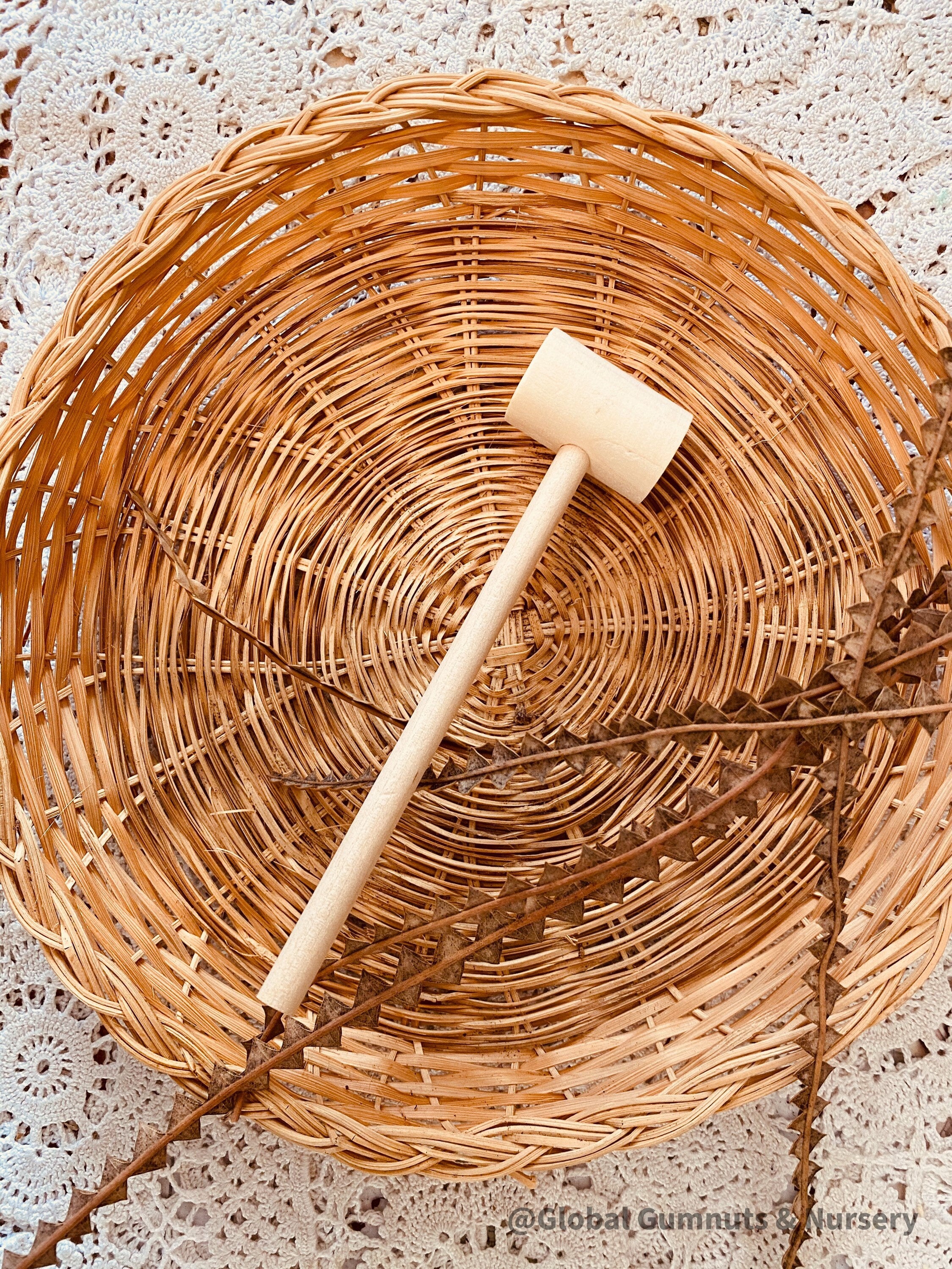 Child Wooden Hammer: Child-sized wooden hammer for sensory and motor skills development.