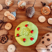 Wooden ladybirds (ladybugs), crafted without stickers for natural play.