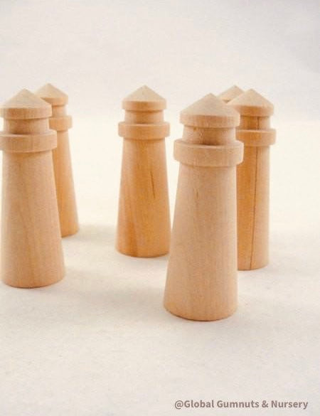 Mini wooden lighthouse, a charming addition to beach-themed decor or playtime.