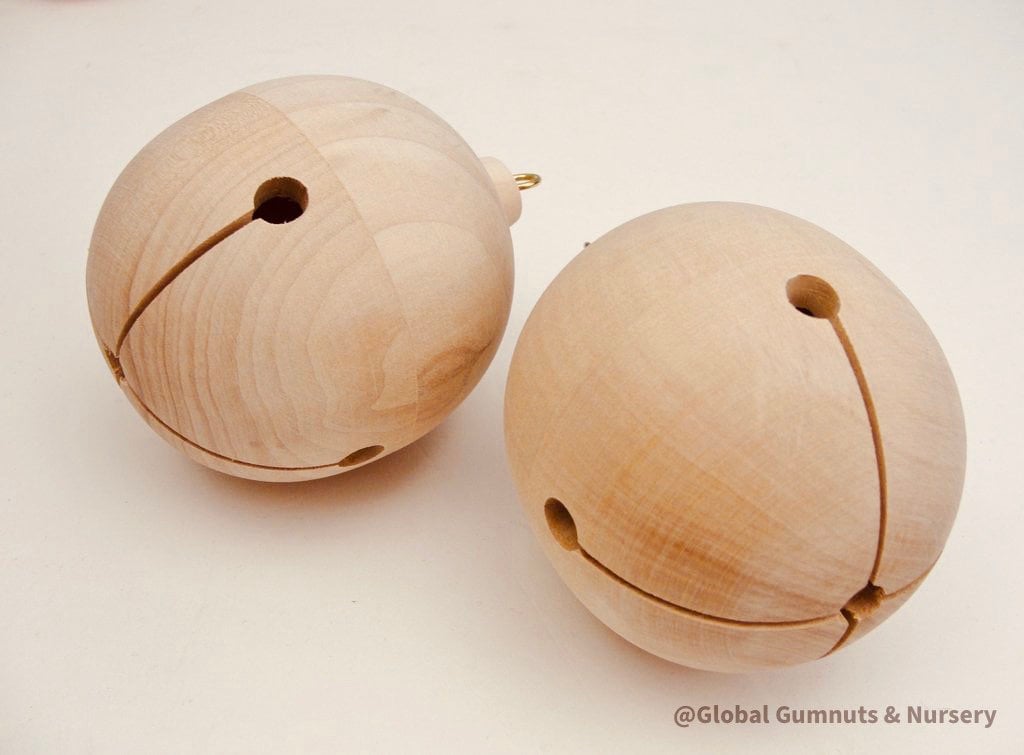 Wooden bell Christmas ornament with chimes, perfect for festive tree decor or rustic holiday charm.