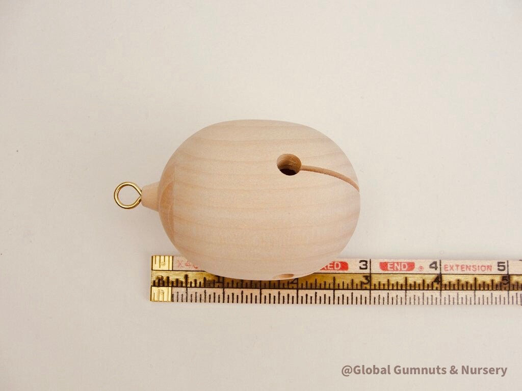 Wooden bell Christmas ornament with chimes, perfect for festive tree decor or rustic holiday charm.