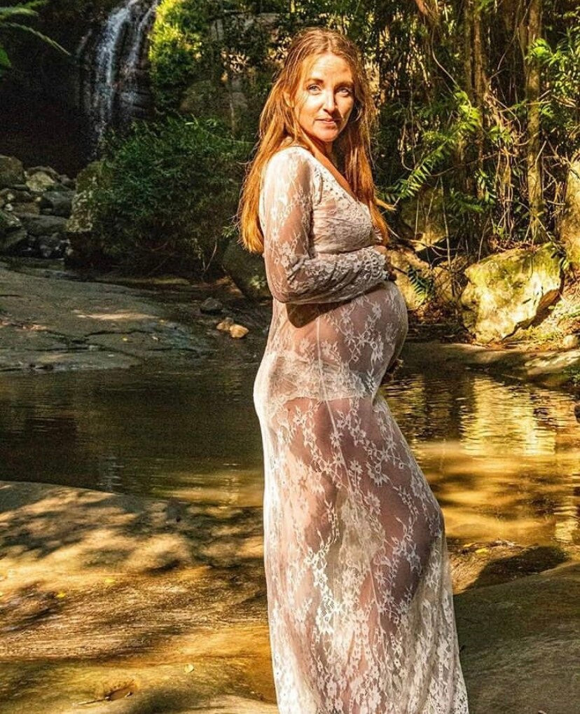White stunning maternity lace dress, perfect for photoshoot style.