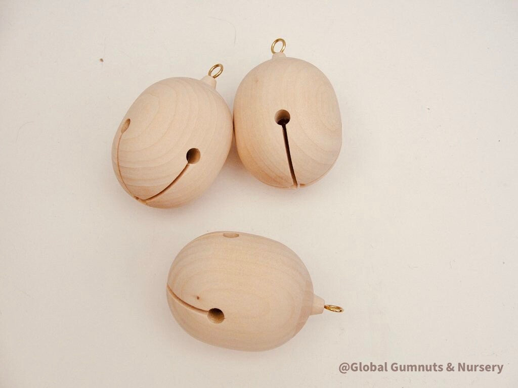 Wooden bell Christmas ornament with chimes, perfect for festive tree decor or rustic holiday charm.