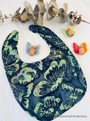 Butterfly Dreams Bib: Luxury bib with butterfly-themed design.