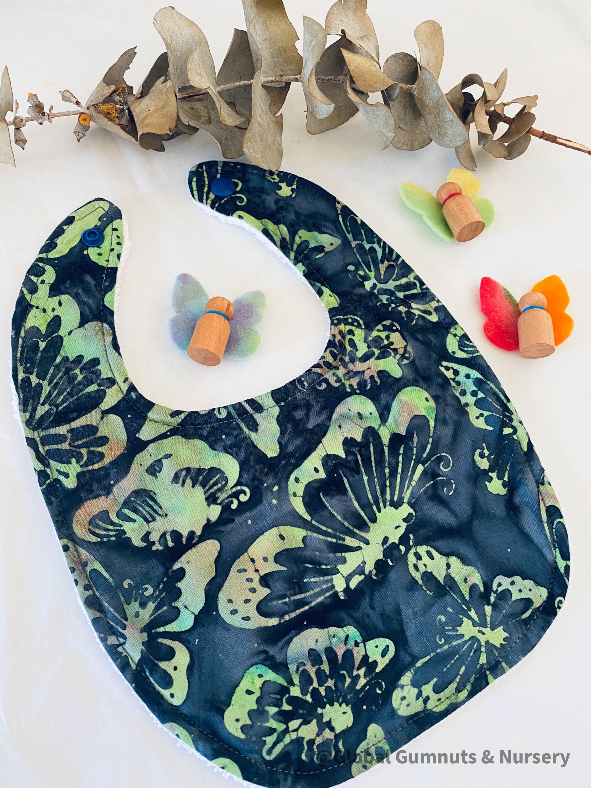 Butterfly Dreams Bib: Luxury bib with butterfly-themed design.